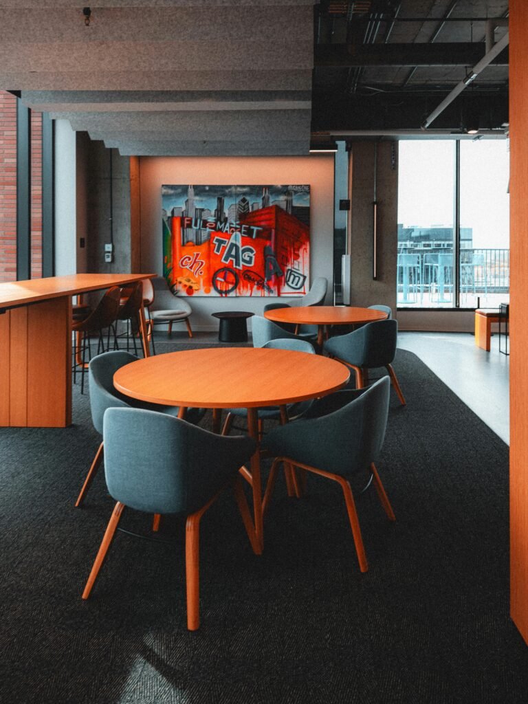 Stylish office space featuring graffiti art and contemporary furniture.
